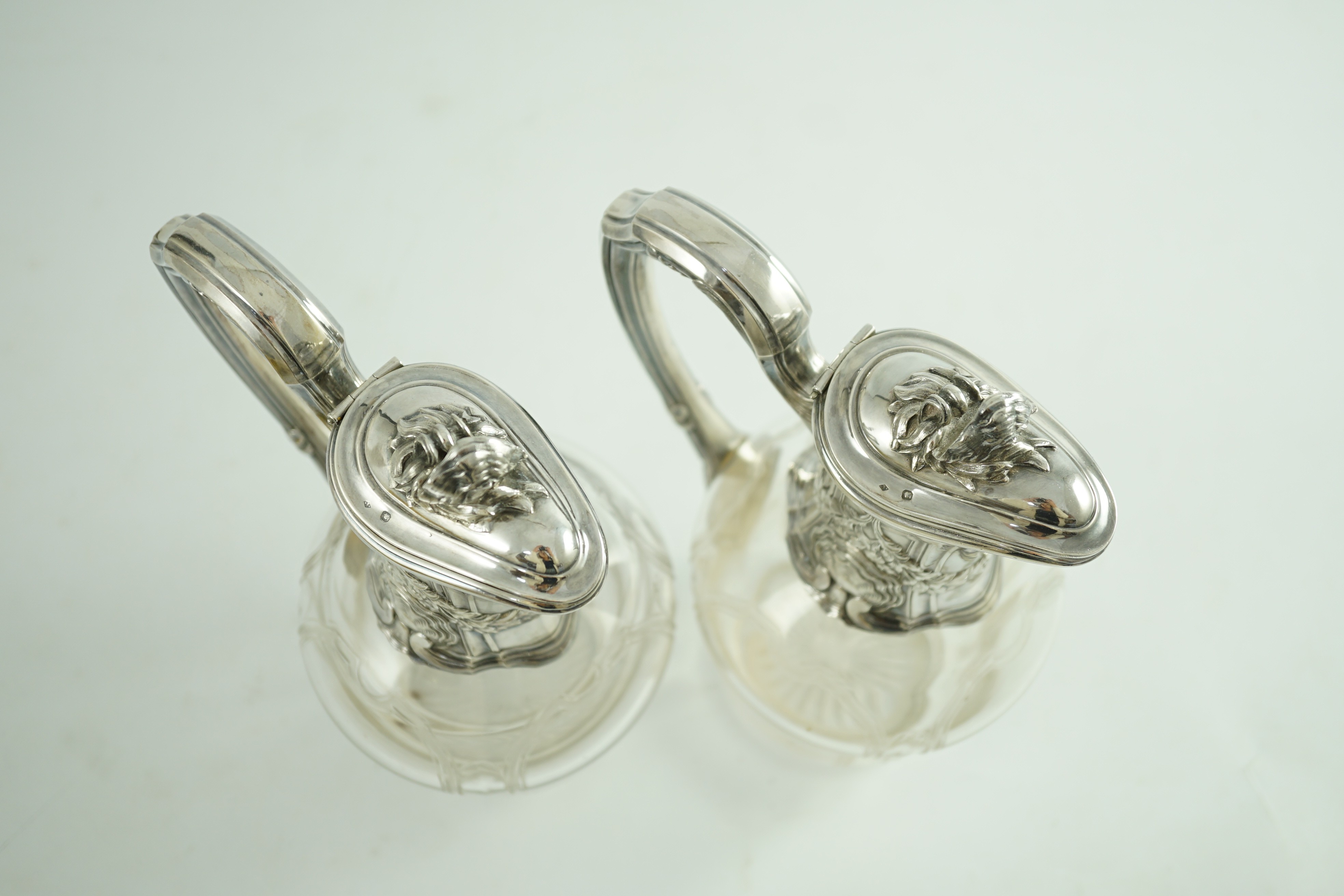 A pair of early 20th century French 950 standard silver mounted glass claret jugs, by Risler & Carre